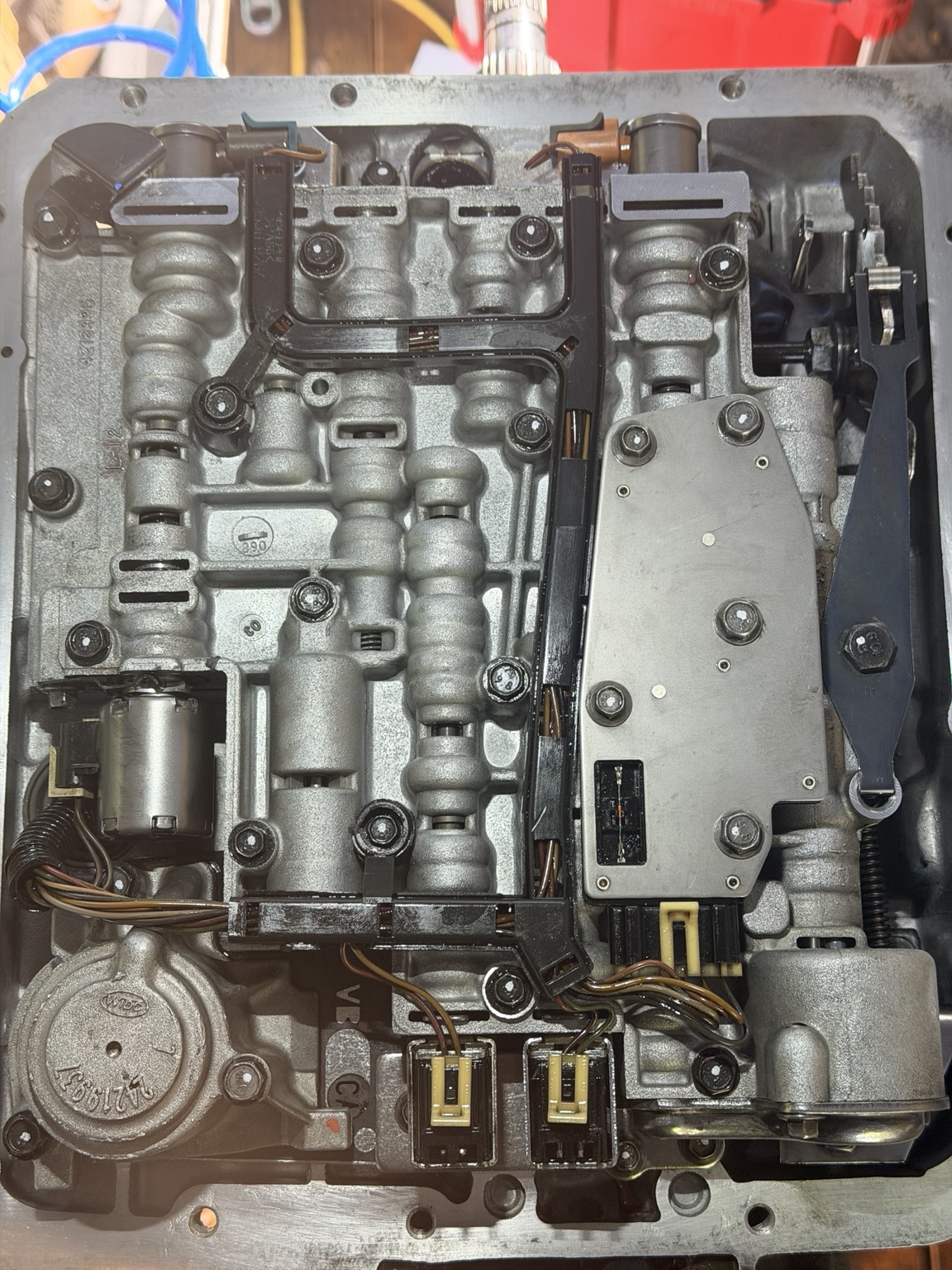 Clean transmission valve body installed with visible torque paint marks